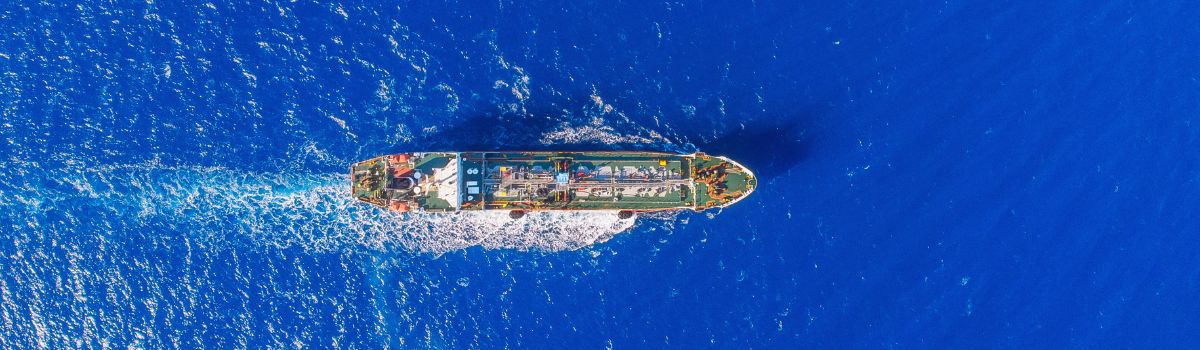 Oil chemical tanker sails blue sea. Aerial top view